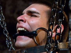 Nick Moretti fucks a pain slut in the electrified metal cage.